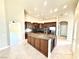 Gourmet kitchen with granite countertops, custom cabinets, and stainless steel appliances at 5451 Fernwood Ct, Pahrump, NV 89061