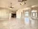 Open-concept living room with tile floors, decorative lighting, and easy access to kitchen at 5451 Fernwood Ct, Pahrump, NV 89061