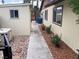 Home backyard with shed, walkway, and rock-covered garden beds at 5821 Santa Catalina Ave, Las Vegas, NV 89108