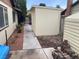 Home featuring a storage shed and gravel walkway in the backyard at 5821 Santa Catalina Ave, Las Vegas, NV 89108