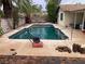 Outdoor pool area with decorative hardscape and desert landscaping at 5821 Santa Catalina Ave, Las Vegas, NV 89108