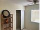 Neutral bedroom features a closet and window, offering functionality and style at 5821 Santa Catalina Ave, Las Vegas, NV 89108