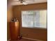 This bedroom offers natural light through the window and ample storage in the dresser at 5821 Santa Catalina Ave, Las Vegas, NV 89108