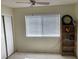 Bright bedroom with a large window, white blinds, and a ceiling fan at 5821 Santa Catalina Ave, Las Vegas, NV 89108