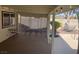 Inviting covered patio with lattice accent, outdoor dining, and direct backyard access at 5821 Santa Catalina Ave, Las Vegas, NV 89108