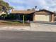 Charming one-story home with well-maintained lawn and two-car garage at 5821 Santa Catalina Ave, Las Vegas, NV 89108