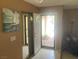 Open foyer area featuring tile flooring, a coat closet and natural light from the front door at 5821 Santa Catalina Ave, Las Vegas, NV 89108