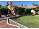 Well-maintained front yard with green lawn, mature landscaping, and charming curb appeal at 5821 Santa Catalina Ave, Las Vegas, NV 89108