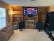 Cozy living room features built-in shelving and a brick fireplace, perfect for entertaining at 5821 Santa Catalina Ave, Las Vegas, NV 89108