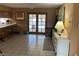 Bright living area with tile flooring, and double door access to the pool and backyard at 5821 Santa Catalina Ave, Las Vegas, NV 89108