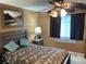 Relaxing main bedroom with ceiling fan and window, providing comfort and style at 5821 Santa Catalina Ave, Las Vegas, NV 89108