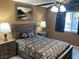 Tranquil main bedroom with stylish lamps, ceiling fan and bedside tables, creating a cozy ambiance at 5821 Santa Catalina Ave, Las Vegas, NV 89108