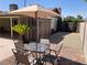 Patio with dining set and umbrella, in a private backyard setting at 5821 Santa Catalina Ave, Las Vegas, NV 89108