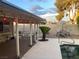 A covered patio with outdoor furniture and a view of the sparkling pool at 5821 Santa Catalina Ave, Las Vegas, NV 89108