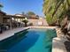 Refreshing pool surrounded by palm trees creates a private outdoor oasis at 5821 Santa Catalina Ave, Las Vegas, NV 89108