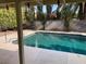 Tranquil poolside view with lush landscaping enhances the outdoor living experience at 5821 Santa Catalina Ave, Las Vegas, NV 89108