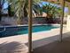 Private swimming pool with lush landscaping and a covered patio at 5821 Santa Catalina Ave, Las Vegas, NV 89108