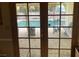 Inviting backyard pool view through French doors adds natural light and outdoor enjoyment at 5821 Santa Catalina Ave, Las Vegas, NV 89108
