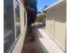 Exterior view of home's side yard with flowering plants and storage shed at 5821 Santa Catalina Ave, Las Vegas, NV 89108