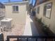 Exterior view of home's side yard with flowering plants and storage shed at 5821 Santa Catalina Ave, Las Vegas, NV 89108