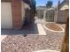 Low maintenance side yard with secure gate access to backyard at 5821 Santa Catalina Ave, Las Vegas, NV 89108