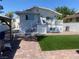 Inviting backyard featuring a raised deck, fenced yard, and well-maintained landscaping at 615 D Ave, Boulder City, NV 89005