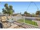 Backyard deck featuring comfortable seating overlooking a landscaped yard with a trampoline at 615 D Ave, Boulder City, NV 89005