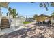 Landscaped backyard featuring a covered patio, an outdoor kitchen, and a trampoline at 615 D Ave, Boulder City, NV 89005