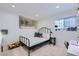 A cozy bedroom featuring a decorative sleeping nook, black metal bed, and a study space at 615 D Ave, Boulder City, NV 89005