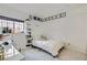 Cozy bedroom with decorative string lights, accent shelves, and a large window at 615 D Ave, Boulder City, NV 89005