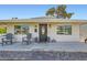Inviting single-story home with a well-manicured lawn and charming front porch at 615 D Ave, Boulder City, NV 89005