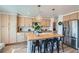 Well-lit kitchen showcases an island with seating, updated appliances, and ample countertop space at 615 D Ave, Boulder City, NV 89005