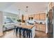 Bright kitchen featuring a large center island, modern appliances, and light wood cabinetry at 615 D Ave, Boulder City, NV 89005