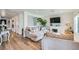 Open-concept living room with hardwood floors, fireplace, and plenty of natural light at 615 D Ave, Boulder City, NV 89005