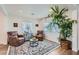 Inviting living room with ample seating, a decorative rug, and a large potted plant at 615 D Ave, Boulder City, NV 89005