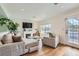Bright living room featuring hardwood floors, a fireplace, and modern furniture at 615 D Ave, Boulder City, NV 89005