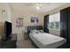 Bedroom featuring carpet floors, window with black out curtains, and a TV at 6217 Lapilli Ave, Las Vegas, NV 89139
