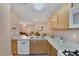 A kitchen featuring wooden cabinets, sleek countertops, and modern appliances at 6217 Lapilli Ave, Las Vegas, NV 89139