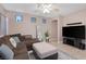 Comfortable living area with brown sectional sofa and neutral-toned walls at 6217 Lapilli Ave, Las Vegas, NV 89139