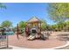 A vibrant community playground with slides, swings, and climbing structures offers a fun recreational space at 6217 Lapilli Ave, Las Vegas, NV 89139