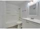 This bathroom features a tub and shower combination, sink, and white cabinets at 6800 E Lake Mead Blvd # 1034, Las Vegas, NV 89156