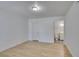 This bedroom offers neutral walls, plank flooring, and en suite bathroom at 6800 E Lake Mead Blvd # 1034, Las Vegas, NV 89156