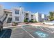 Well-maintained condo building features stucco walls, tile roof, and landscaped grounds at 6800 E Lake Mead Blvd # 1034, Las Vegas, NV 89156