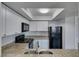 Bright kitchen features modern appliances, granite countertops, and white cabinets at 6800 E Lake Mead Blvd # 1034, Las Vegas, NV 89156
