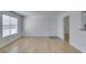 Bright, open living room with new wood-look flooring, neutral walls, and lots of natural light at 6800 E Lake Mead Blvd # 1034, Las Vegas, NV 89156