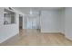 Living room features wood-look floors and neutral paint with pass-through to kitchen at 6800 E Lake Mead Blvd # 1034, Las Vegas, NV 89156