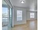 Modern living space features wood-look flooring, slider to deck, and plenty of light at 6800 E Lake Mead Blvd # 1034, Las Vegas, NV 89156