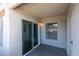 Outdoor patio with a sliding glass door, concrete floor, and exterior closet at 6800 E Lake Mead Blvd # 1034, Las Vegas, NV 89156
