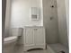 This remodeled bathroom features a walk-in shower and a single sink vanity at 6905 Singing Dunes Ln, Las Vegas, NV 89145