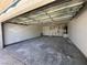 This spacious garage offers plenty of storage space, a door to enter the home, and a bright overhead door at 6905 Singing Dunes Ln, Las Vegas, NV 89145